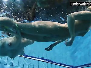 two sexy amateurs displaying their bodies off under water